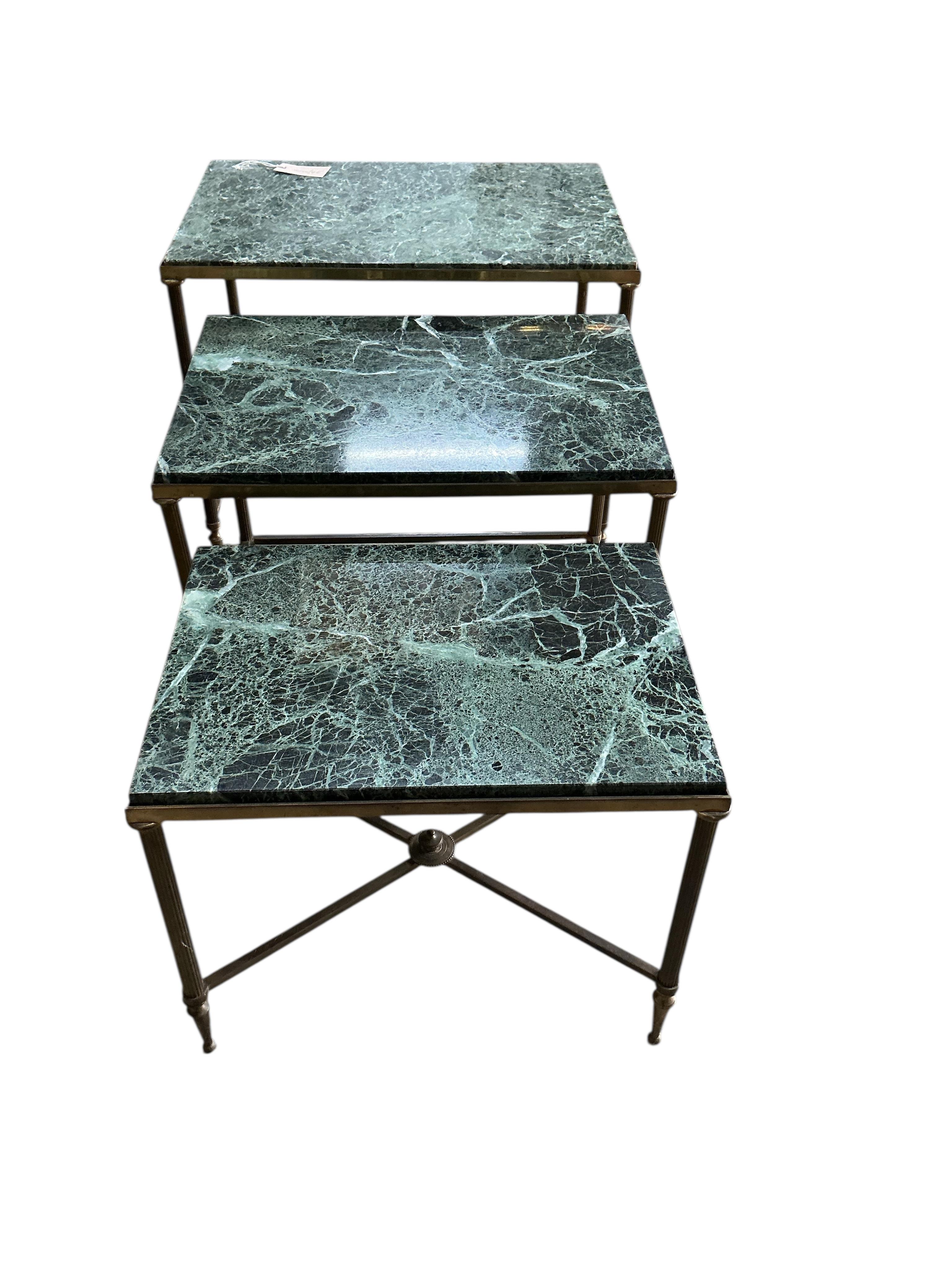 A nest of three Maison Jansen style rectangular brass and marble tables, width 55cm, depth 36cm, height 46cm